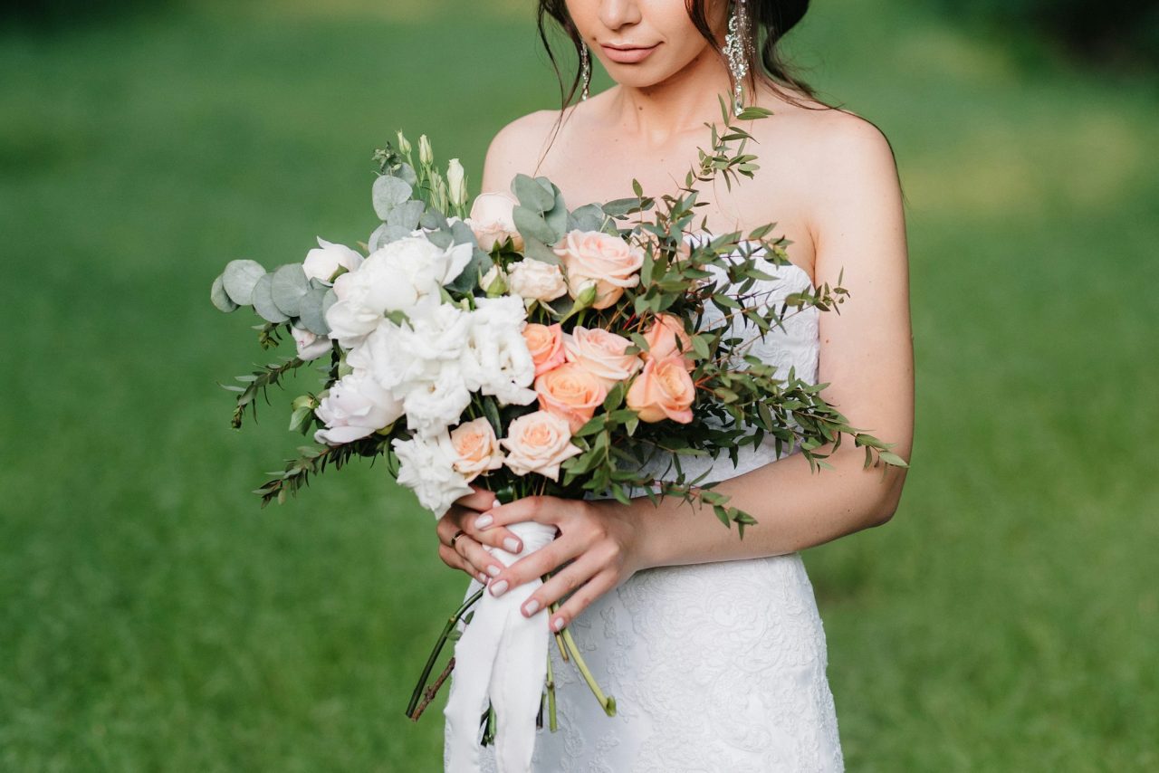 bride-in-a-white-dress-with-a-large-spring-bouquet.jpg