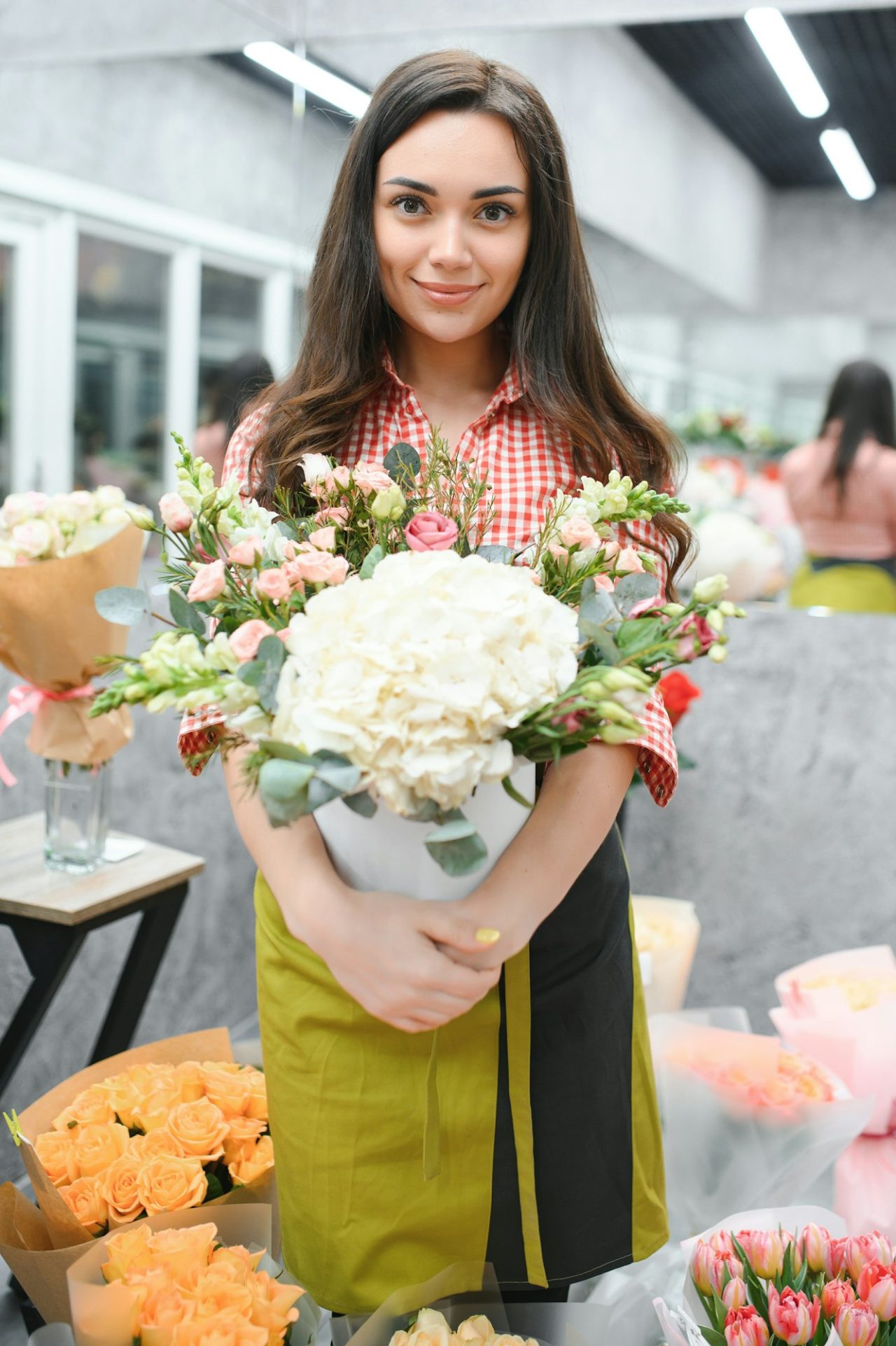 portrait-of-female-florist-in-her-flower-shop-.jpg