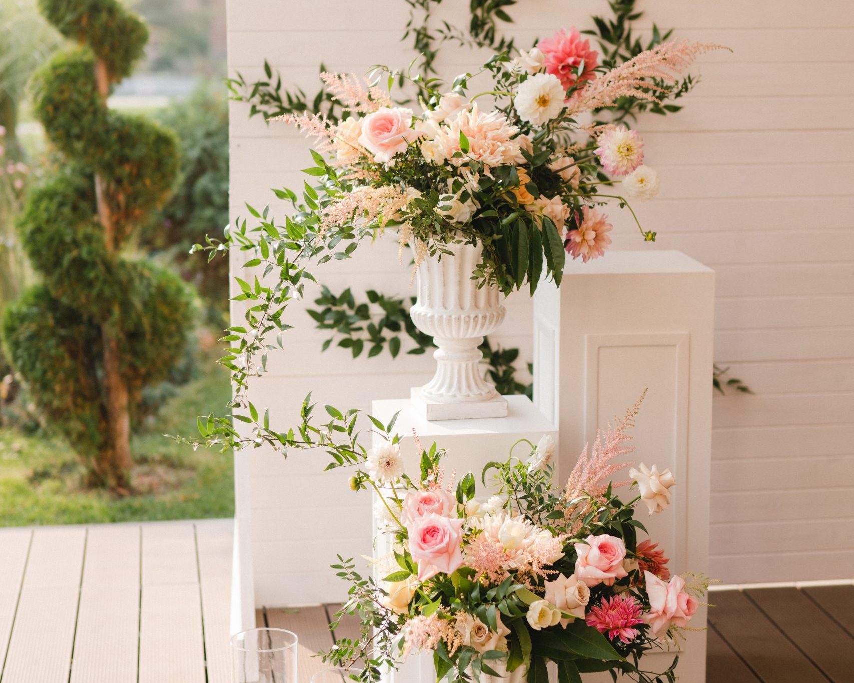 Coziness and style. Modern event design. Lounge zone and european traditional wedding ceremony decoration outdoors in the restaurant before the reception.